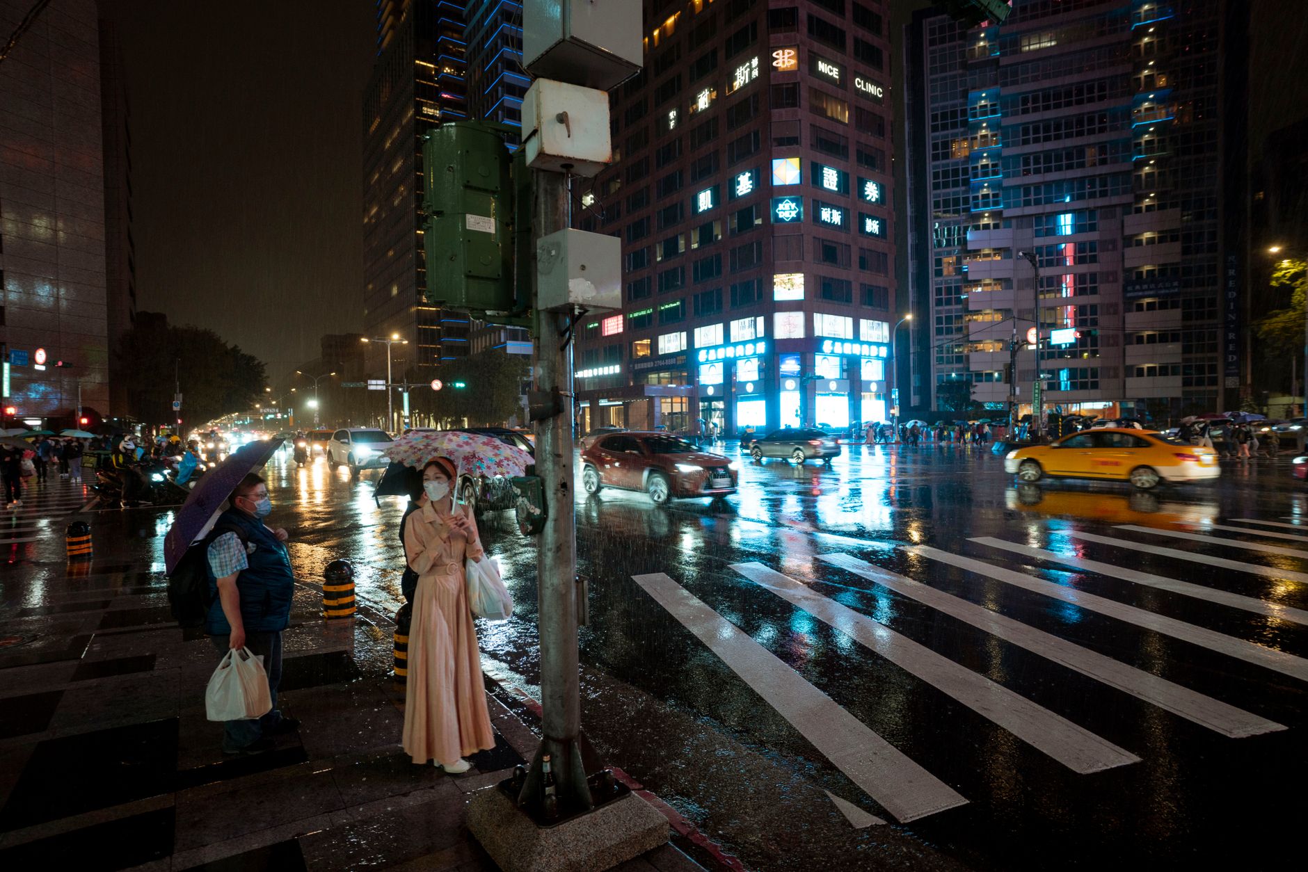 bangkok street rain umbrella pedestrians