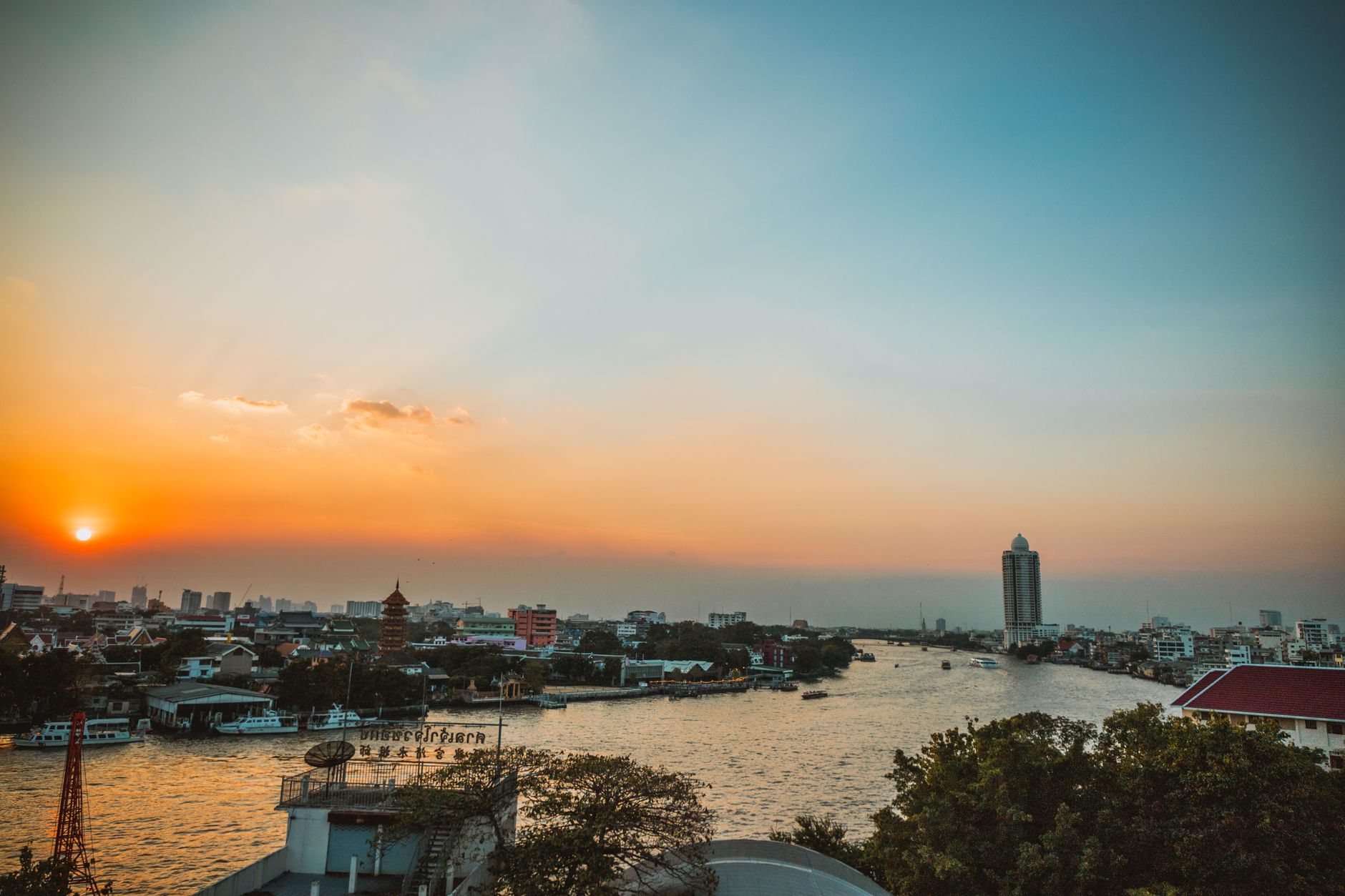 chao phraya river royal barge sunset
